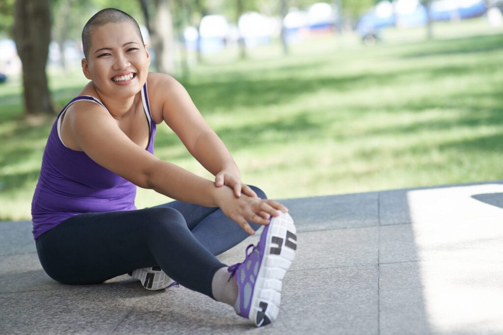 Exercising woman stretching